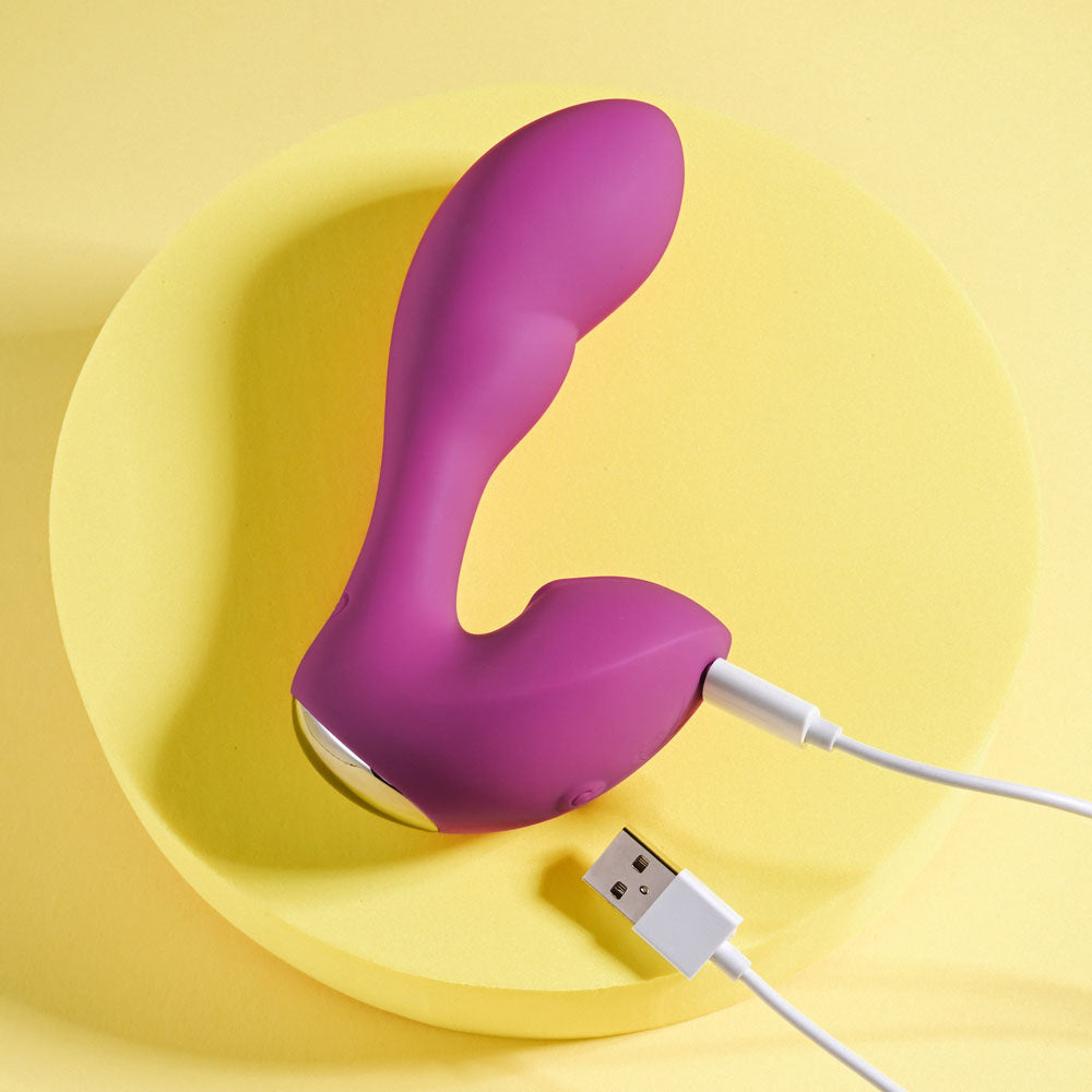 Playboy Pleasure ARCH -  14.1 cm USB Rechargeable G-Spot Vibrator on a yellow background with charging cable.