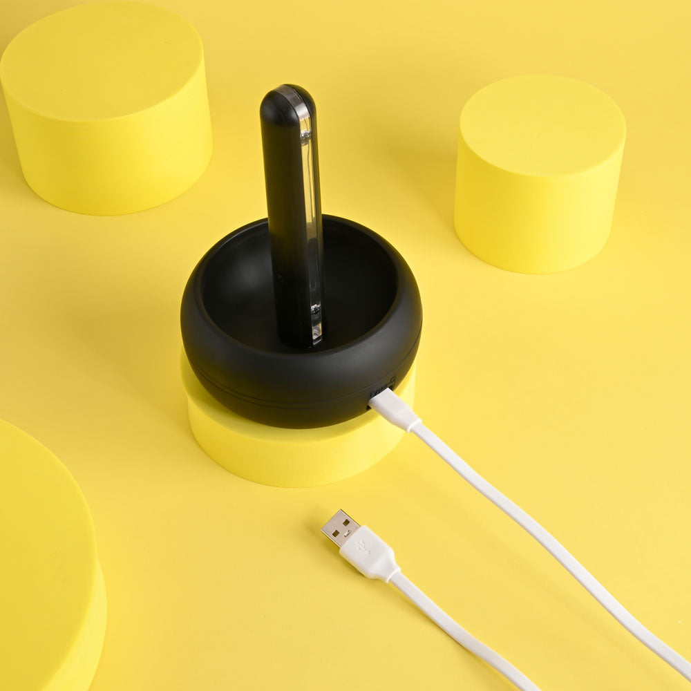 Playboy Pleasure END GAME - USB Rechargeable Vibrating & Self Sanitising Stroker in a sleek charging stand.
