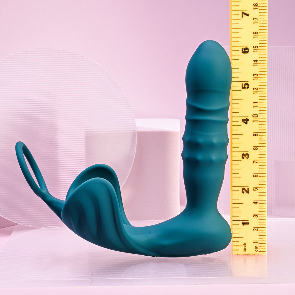 Playboy Pleasure BRING IT ON - Teal USB Rechargeable Thrusting Anal Plug with Cock Ring displayed next to a ruler for size reference.
