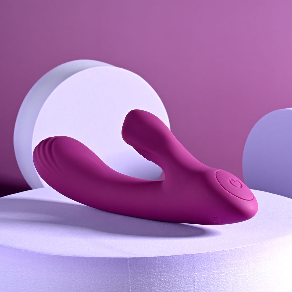 USB rechargeable rabbit vibrator in a vibrant purple color displayed on circular pedestals with a modern design.