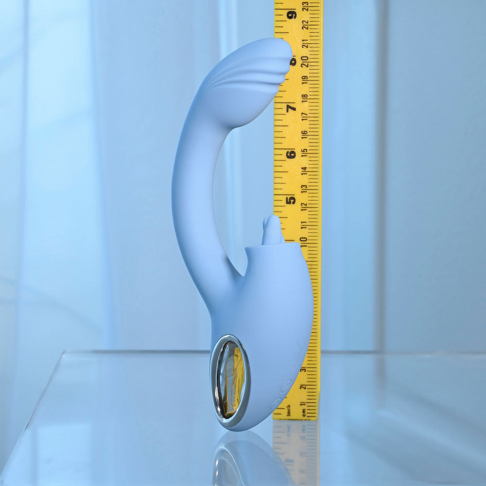 Playboy Pleasure SAPPHIRE SKY - 21.6 cm USB Rechargeable Vibrator with Double Tongue Stimulator next to a measuring tape.