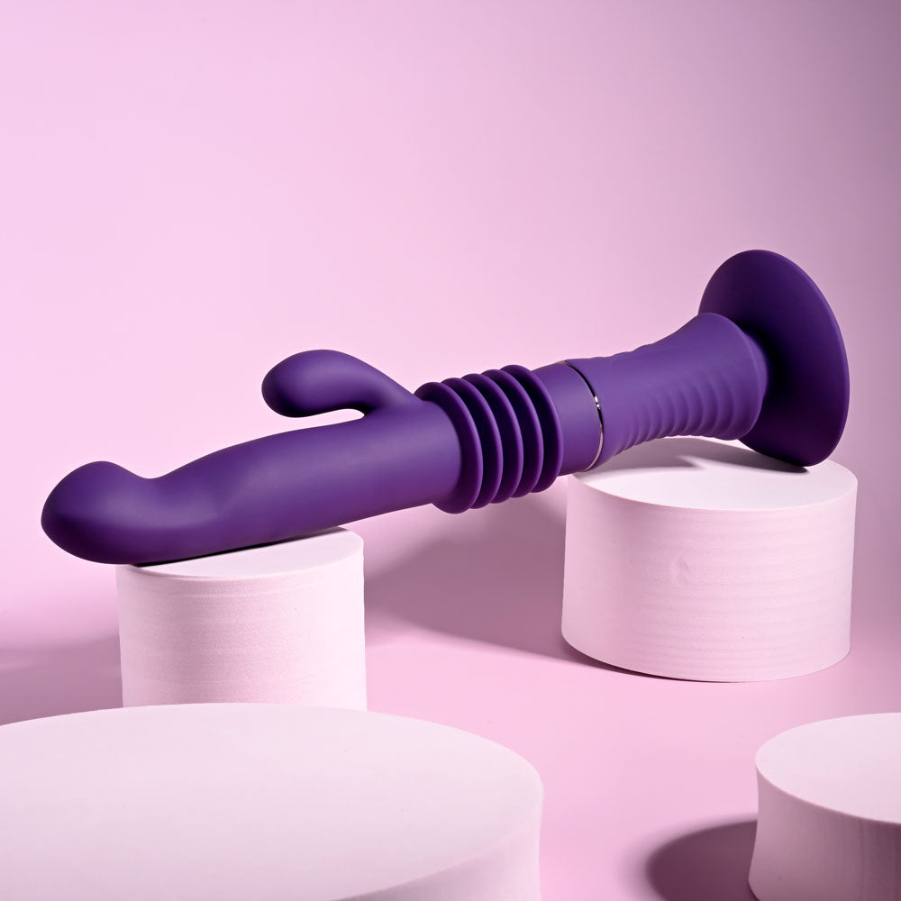 Playboy Pleasure HOPPY ENDING - 29.2 cm USB Rechargeable Thrusting Rabbit Vibrator on display with a purple design.