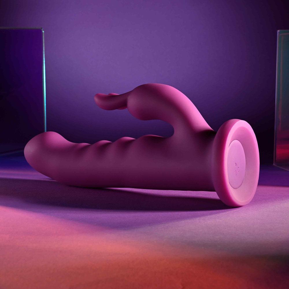 Playboy Pleasure FLUFFLE - 19.7 cm USB Rechargeable Rabbit Vibrator on a colorful background.