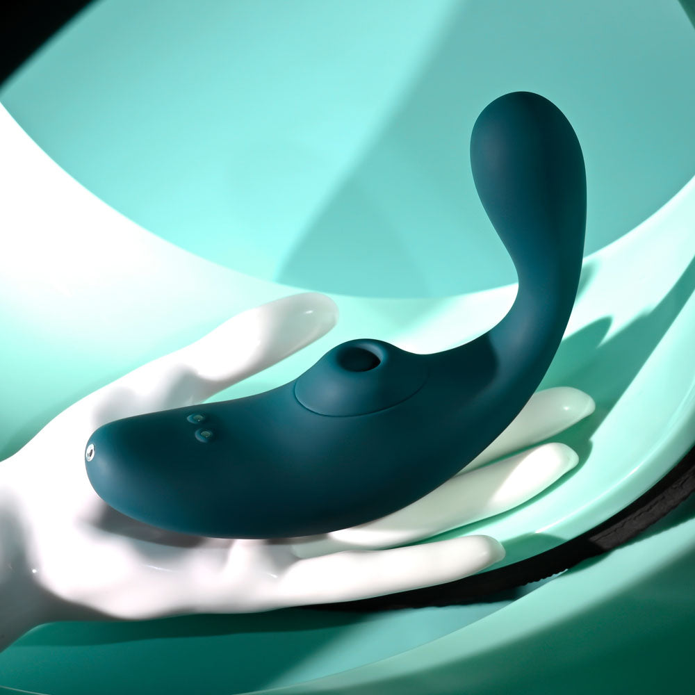 Playboy Pleasure CHARMER - USB Rechargeable Vibrator with Clitoral Suction on a stylish display.
