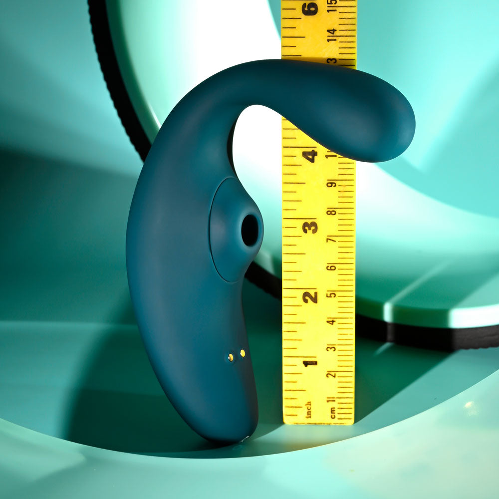 Playboy Pleasure CHARMER - USB Rechargeable Vibrator with Clitoral Suction next to measuring tape for size reference.