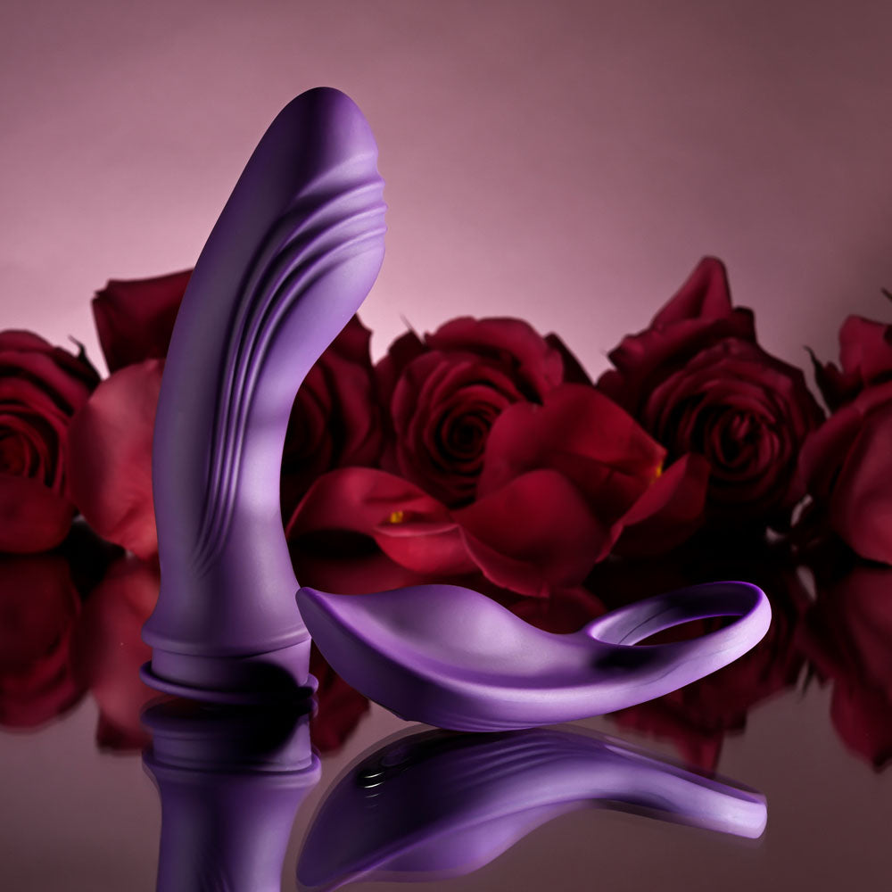 Playboy Pleasure MIX & MATCH USB rechargeable vibrating C-ring and G-Spot vibrator surrounded by roses.