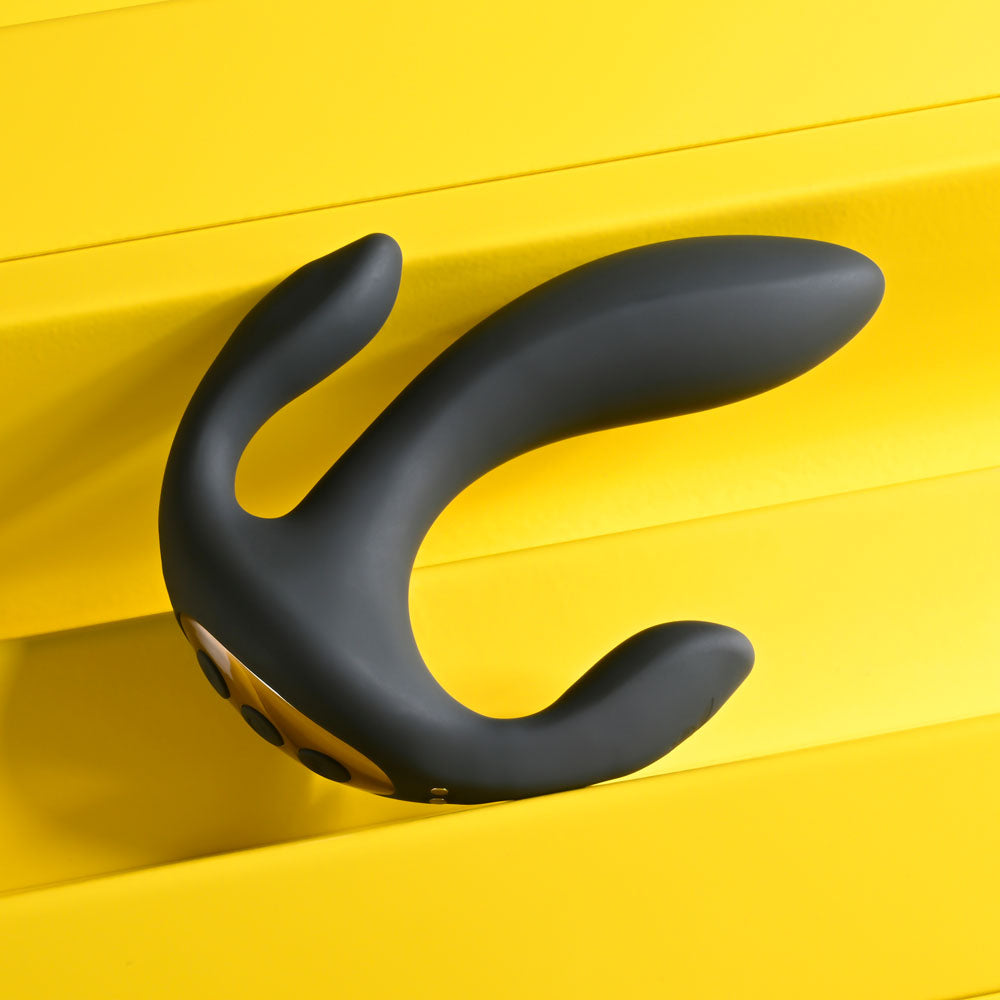 Playboy Pleasure TRIPLE THREAT USB rechargeable triple probe vibrator on a yellow background.