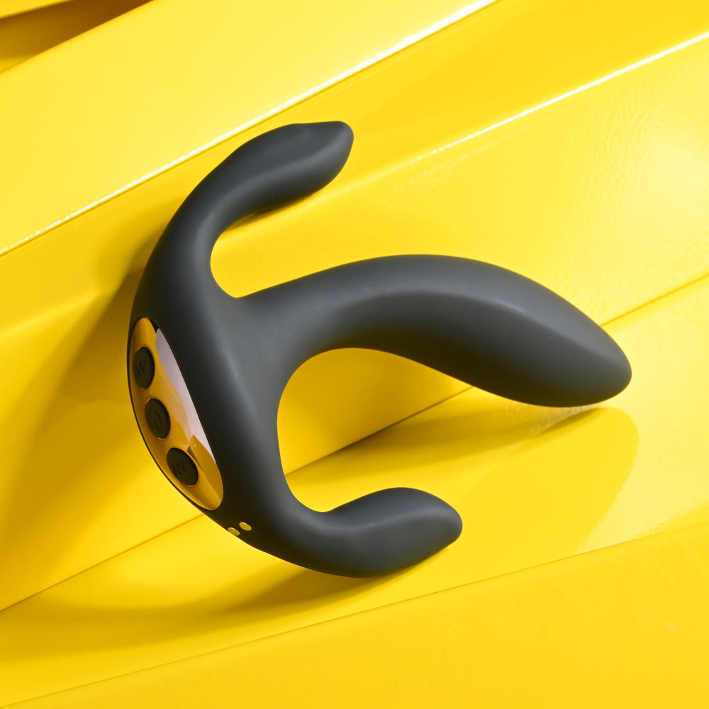 USB rechargeable triple probe vibrator on a bright yellow background.