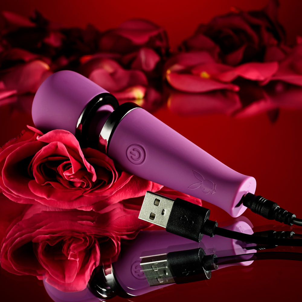 Playboy Pleasure MIC DROP -  11.4 cm USB Rechargeable Vibrating Mini Massage Wand on red background with roses.