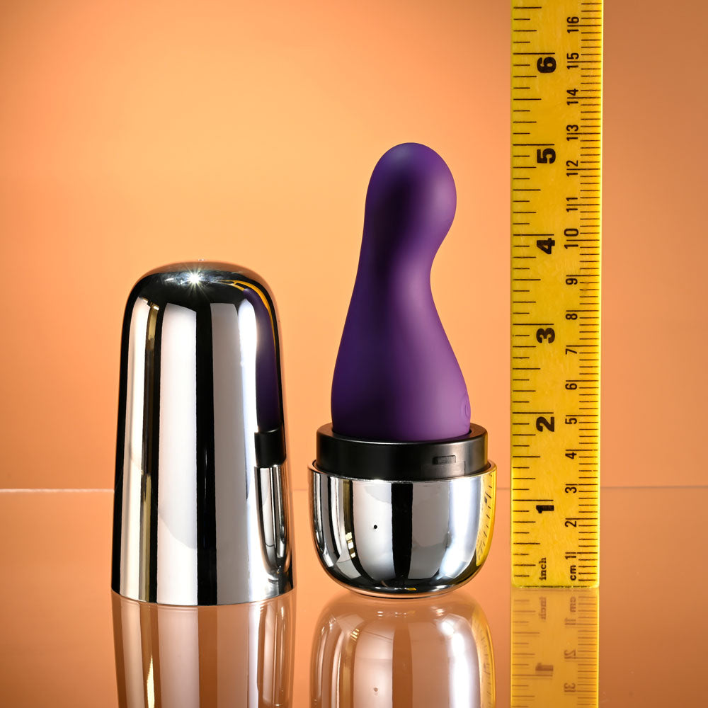 Playboy Pleasure THE JET SET - VIBRATOR - 10.2 cm Vibrator with Self Charging Case on a reflective surface.