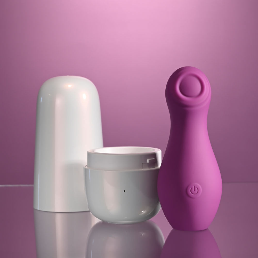 Playboy Pleasure THE JET SET - TAPPING - 10.2 cm Tapping Stimulator with Charging Case displayed on a reflective surface.