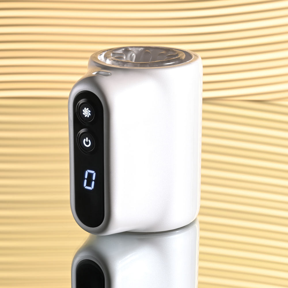 Playboy Pleasure SPIN DOCTOR -  USB Rechargeable Vibrating & Spinning Stroker on a reflective surface.