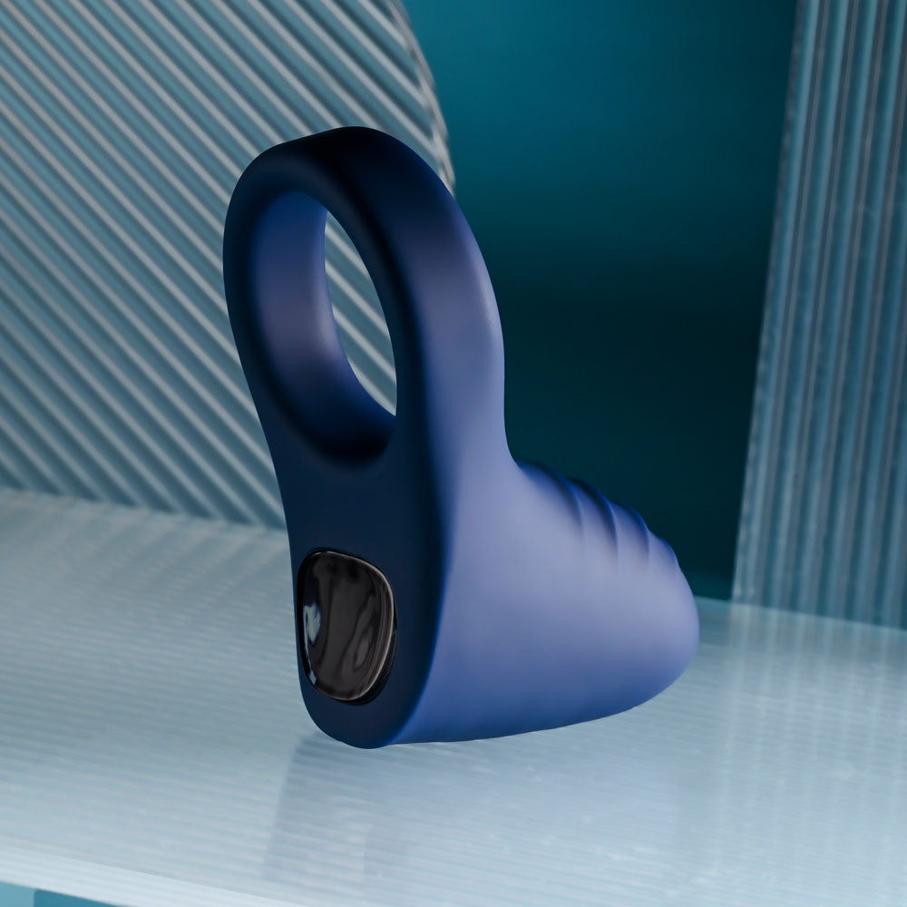 Playboy Pleasure PLEASURE POINT -  USB Rechargeable Vibrating Cock Ring showcased on a sleek surface.