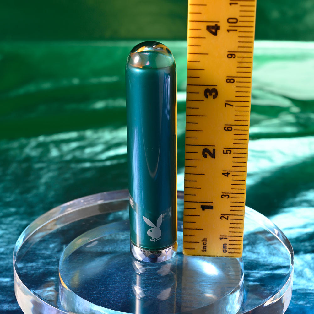 Playboy Pleasure EMERALD -  9.1 cm USB Rechargeable Glass Tipped Bullet on display with ruler for size comparison.