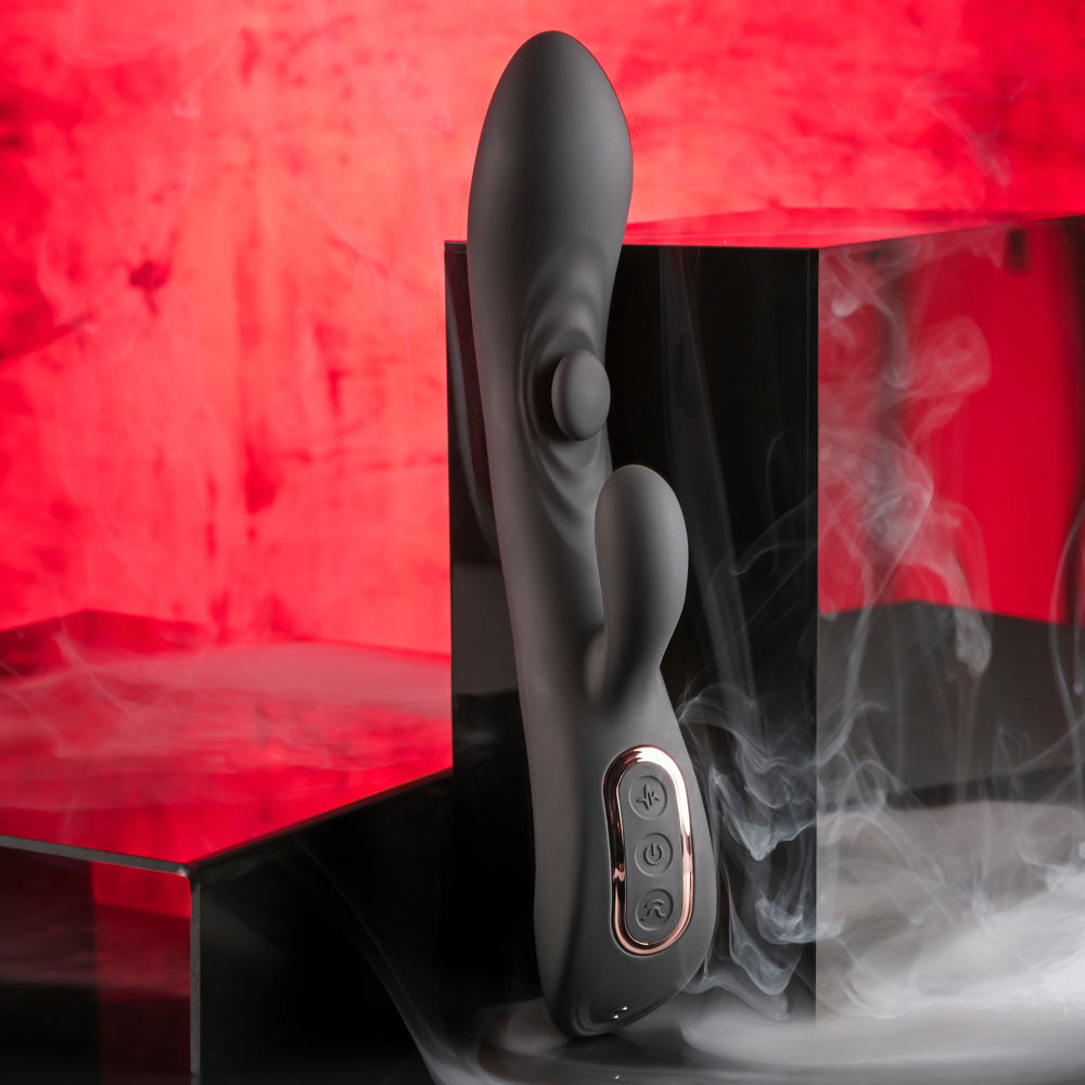 Playboy Pleasure THATS THE SPOT - 23.3 cm USB Rechargeable Rabbit Vibrator with G-Spot Tapper on a sleek backdrop.