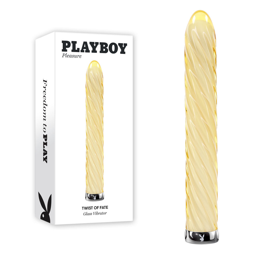Playboy Pleasure TWIST OF FATE USB rechargeable glass vibrator beside its packaging, showcasing design and features.