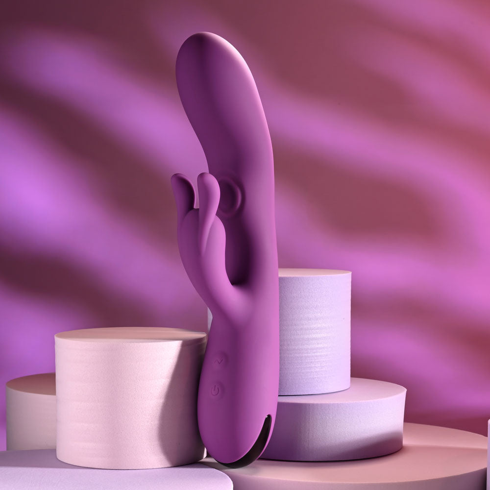 Playboy Pleasure BUSY BUNNY - 22.6 cm USB Rechargeable Rabbit Vibrator with Tapping Shaft on display.