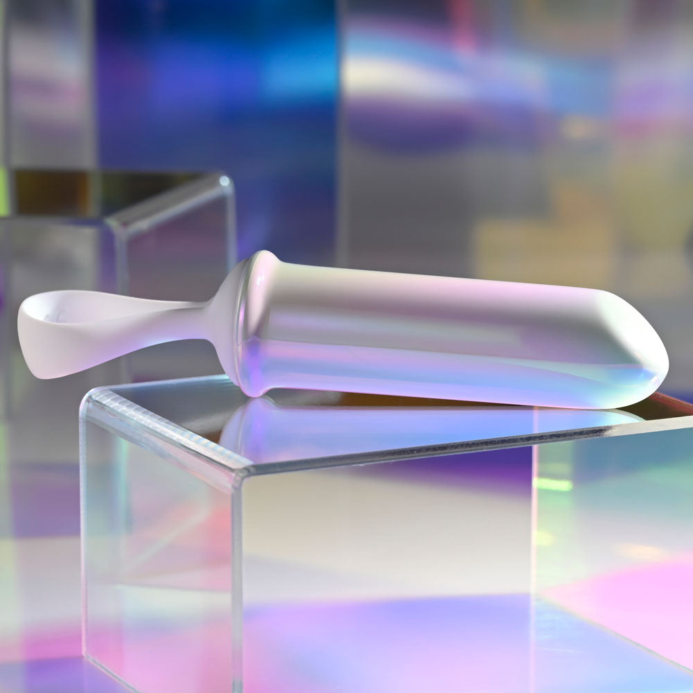 Playboy Pleasure ORGASMIC FANTASY - USB Rechargeable 13.5 cm Bullet on a reflective surface showcasing its iridescent glow.