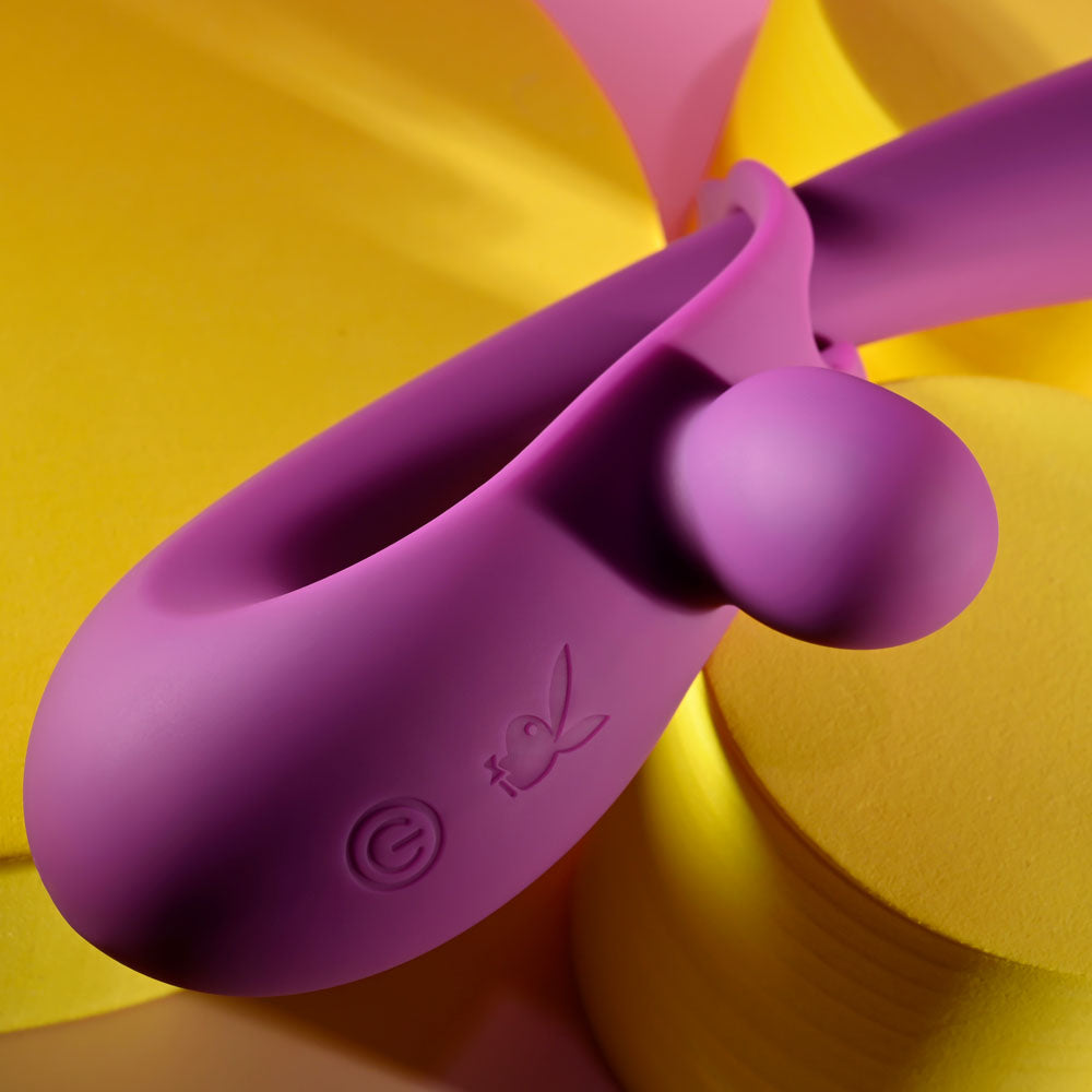 Playboy Pleasure CHA CHA SLIDE -  20 cm USB Rechargeable Rabbit Vibrator on colorful background.