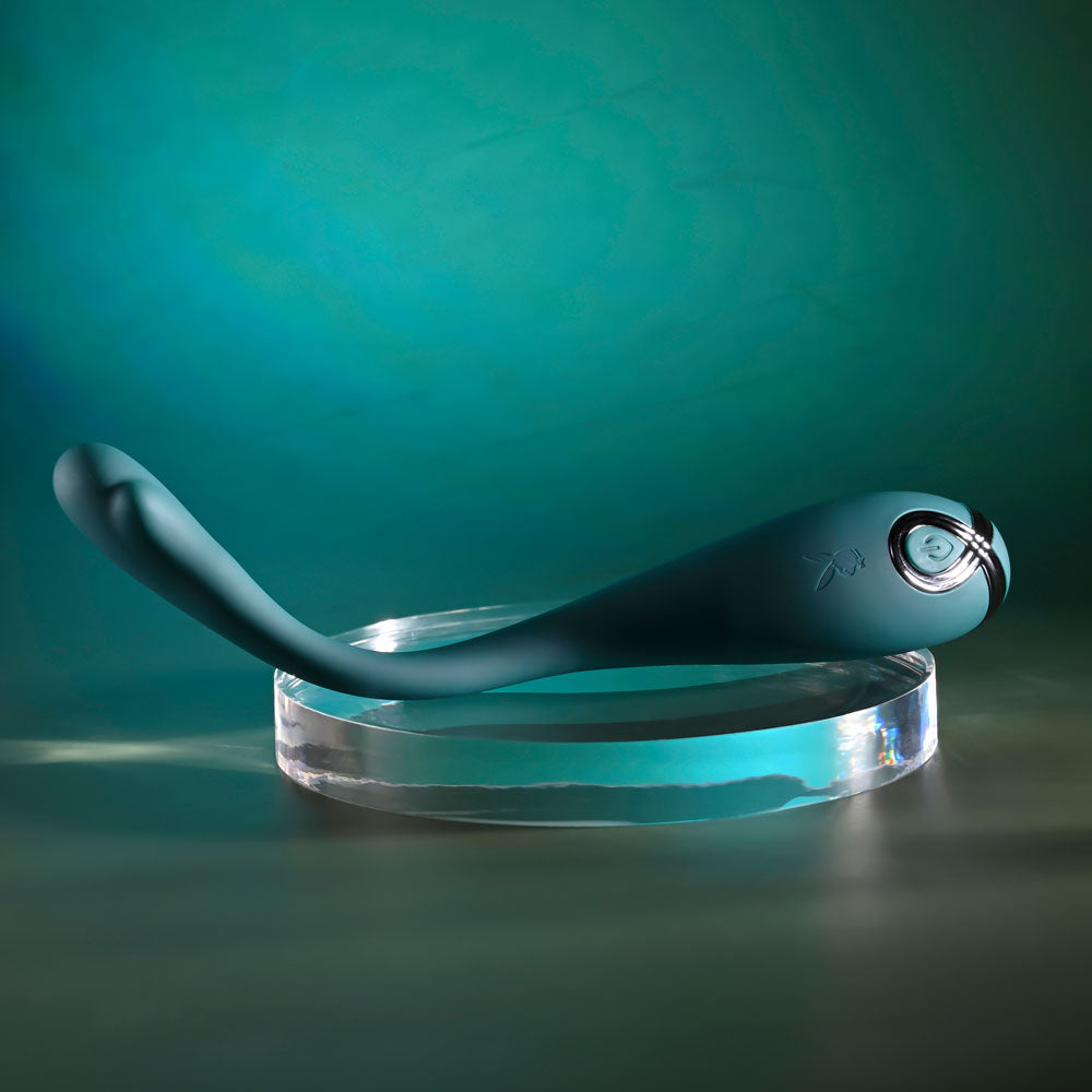 Playboy Pleasure PINPOINT PERFECTION - 19.3 cm USB Rechargeable Poseable Vibrator on a clear display platform.