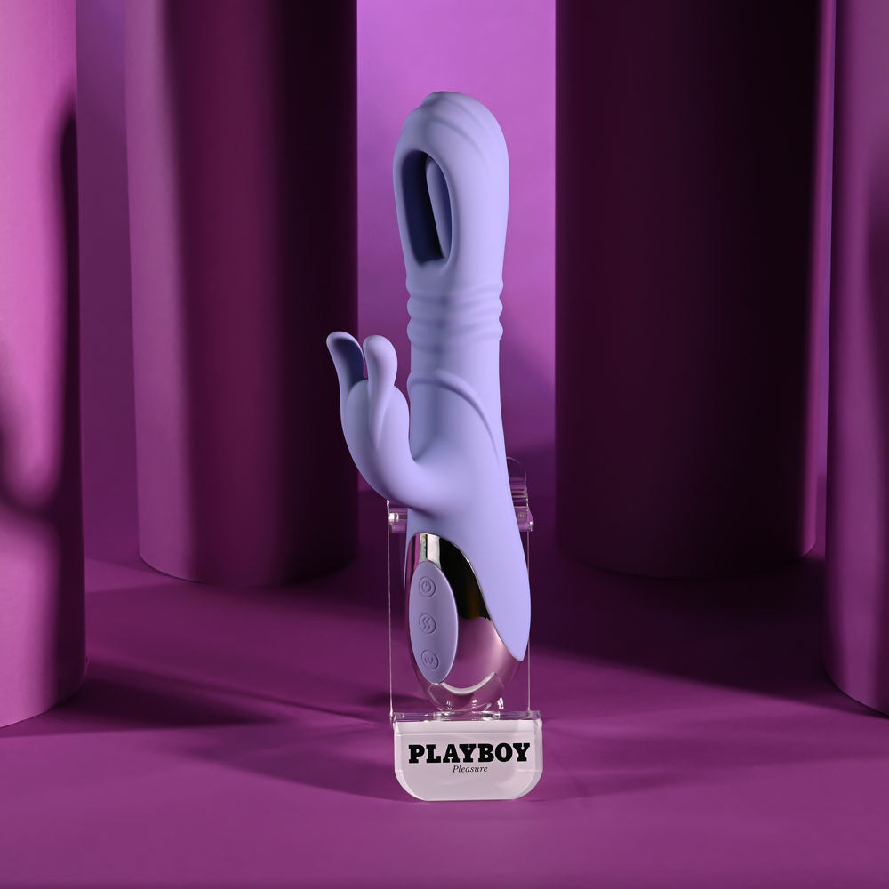 Playboy Pleasure TAP ME IN - 24.2 cm USB rechargeable rabbit vibrator displayed on a purple background.