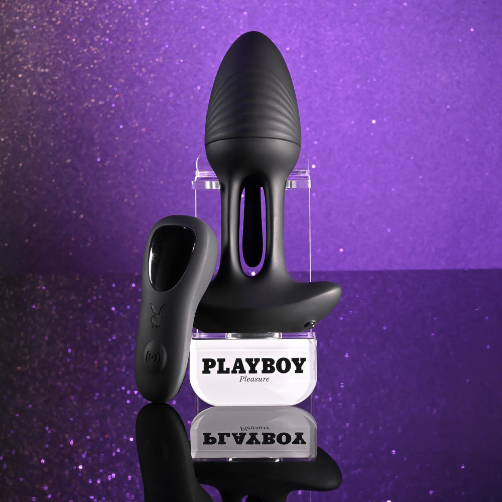 Playboy Pleasure RIM SHOT - 11.4 cm USB Rechargeable Vibrating Butt Plug with remote control on a sparkling background.