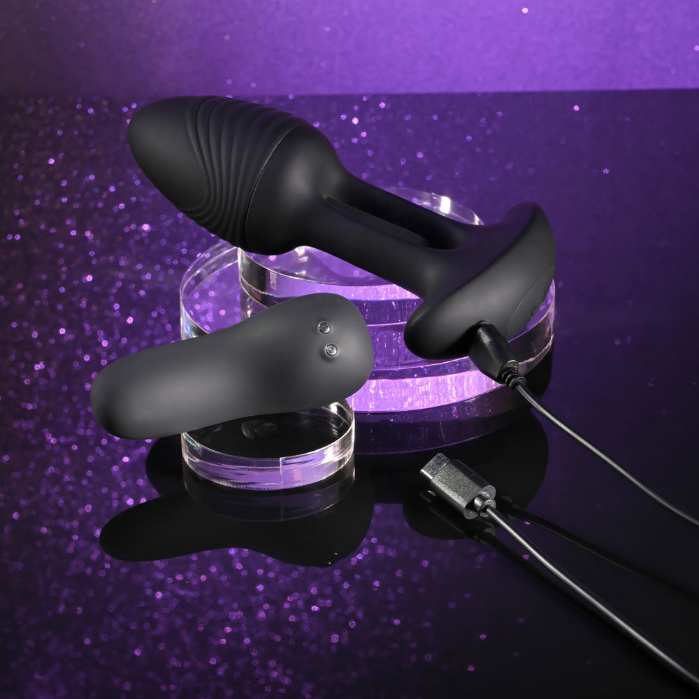 Playboy Pleasure RIM SHOT - 11.4 cm USB Rechargeable Vibrating Butt Plug on display with charging cable.