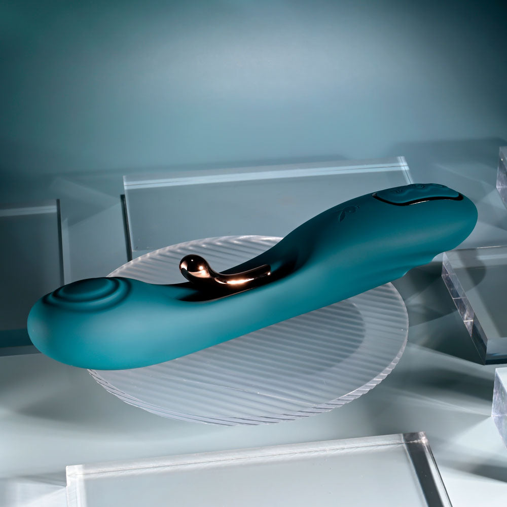 Playboy Pleasure AURELIE - 22.7 cm USB Rechargeable Vibrator with Internal Flicker on a reflective surface.