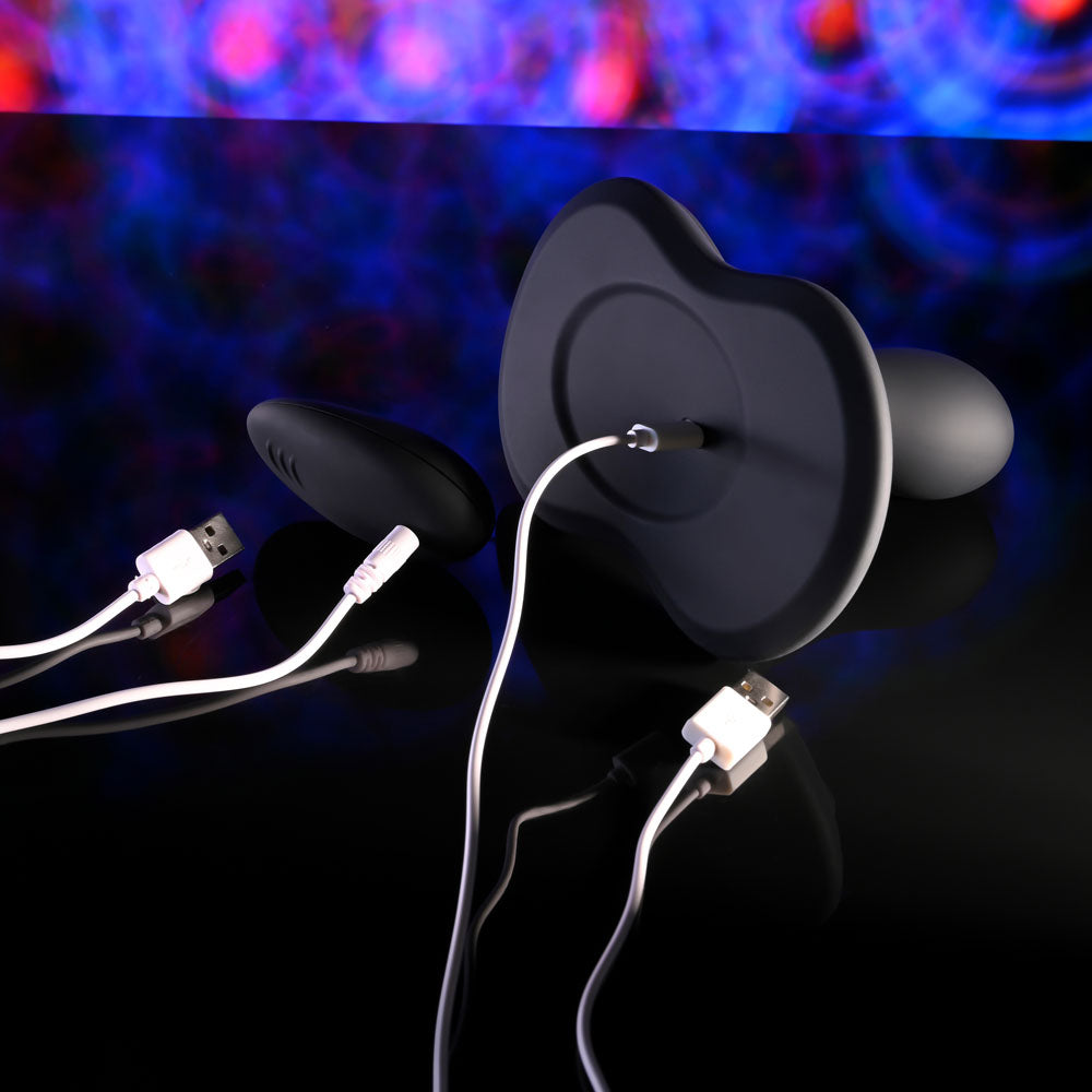 Playboy Pleasure SITTIN & SPINNIN - USB Rechargeable Spinning Vibrator & Grinder Pad with Remote on a reflective surface.