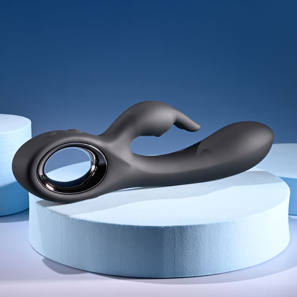 Playboy Pleasure Late Night Bunny - 20 cm USB rechargeable rabbit vibrator on display, featuring sleek black silicone design.