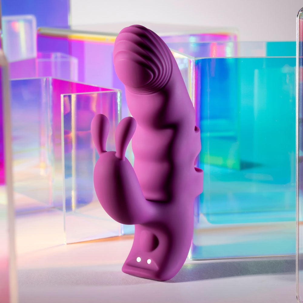 Playboy Pleasure LEND A HAND - USB Rechargeable Finger Vibrator in vibrant purple with dual motors and textured design.