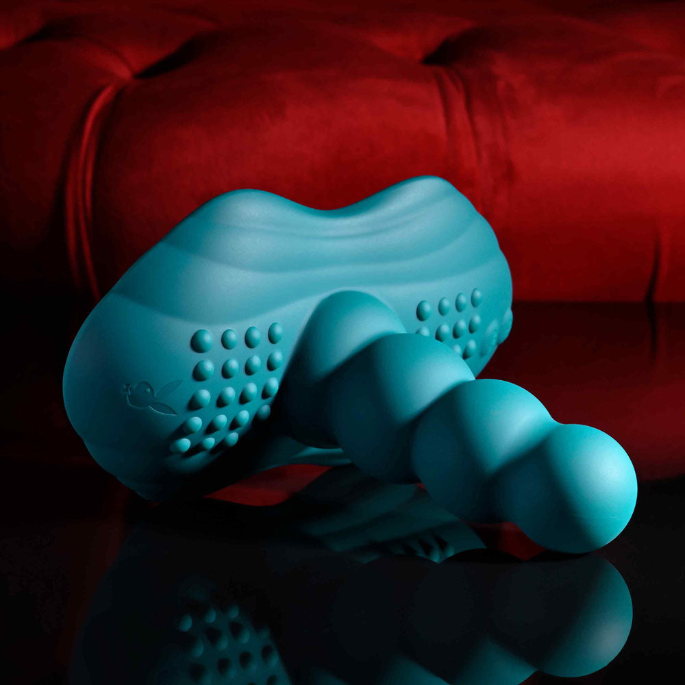 Playboy Pleasure HAVE A SEAT -  USB Rechargeable Rideable Vibrator and Grinder Pad with Remote on black surface