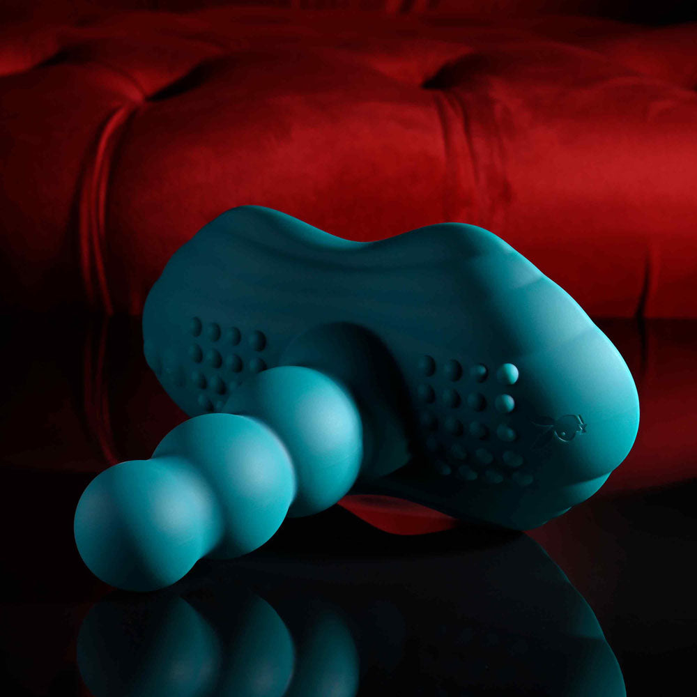 Playboy Pleasure HAVE A SEAT - USB Rechargeable Rideable Vibrator and Grinder Pad with Remote on a reflective surface.