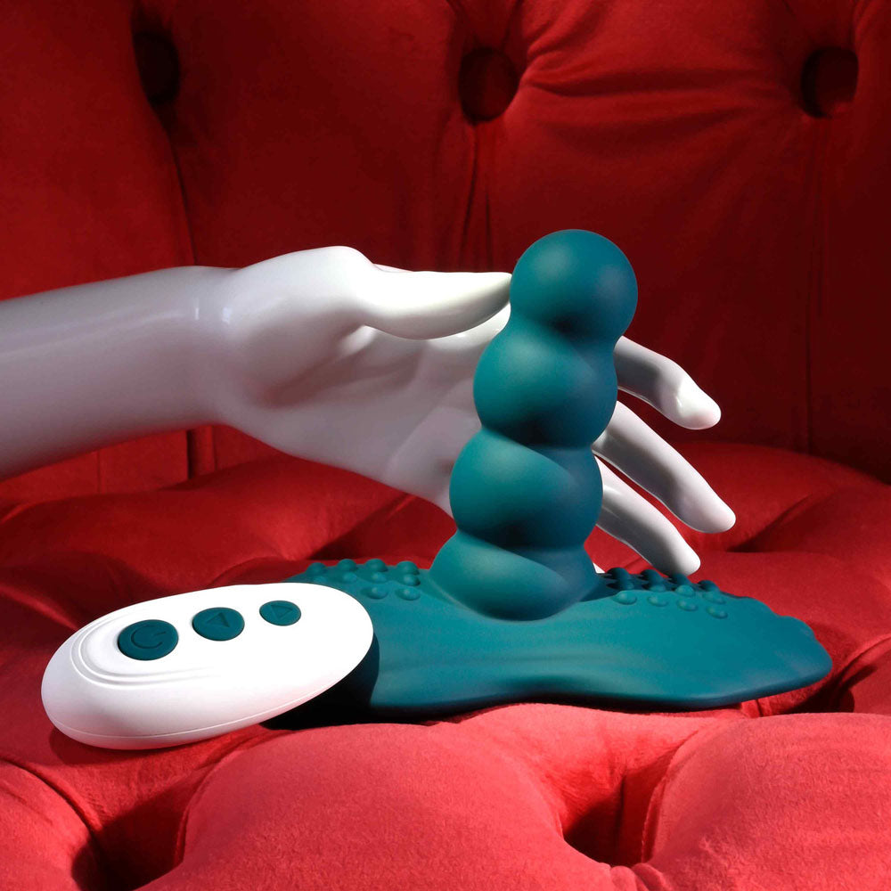 Playboy Pleasure HAVE A SEAT - USB Rechargeable Rideable Vibrator and Grinder Pad with Remote displayed on a plush red background.