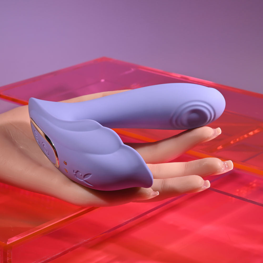 Playboy Pleasure LILAC FANTASY -  13.5 cm USB Rechargeable Tapping Vibrator with Remote on a colorful background.