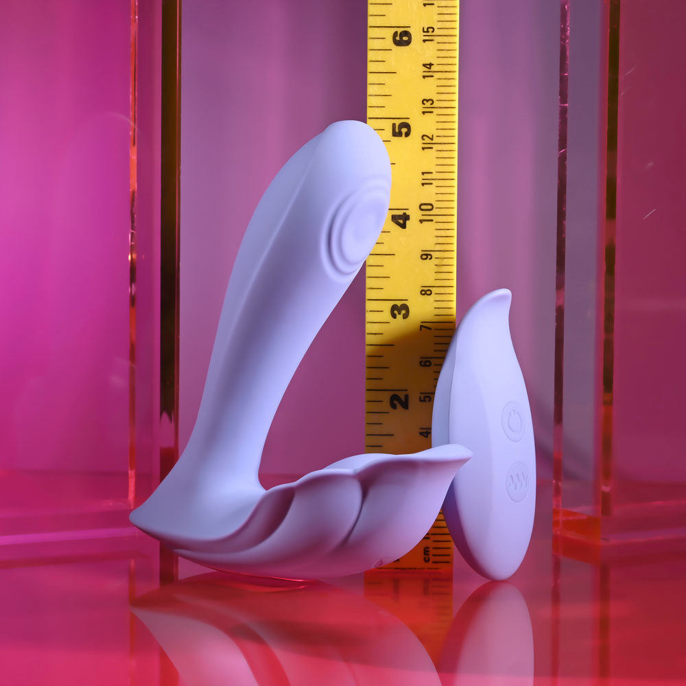 Playboy Pleasure LILAC FANTASY -  13.5 cm USB Rechargeable Tapping Vibrator with Remote next to measuring tape.