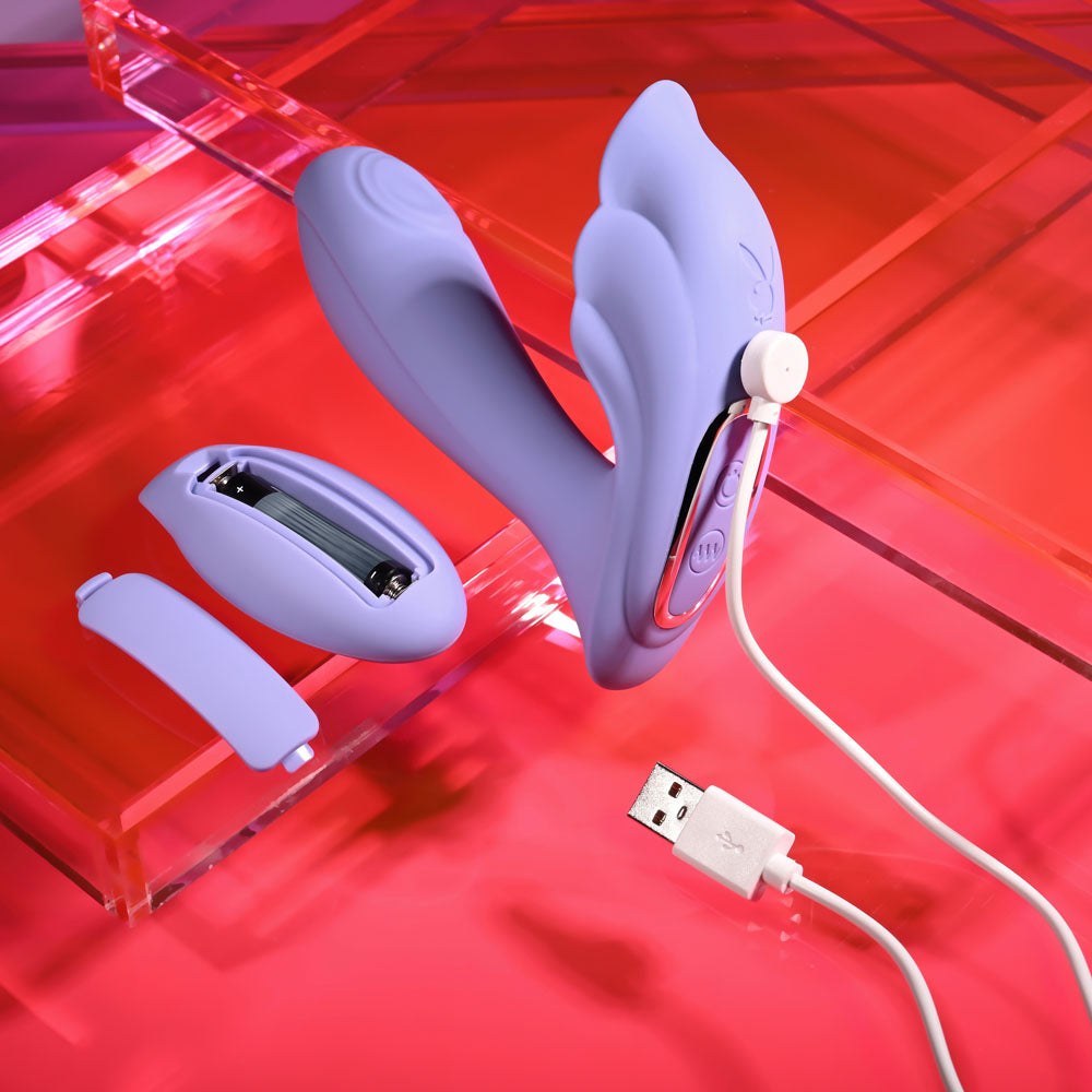 Playboy Pleasure LILAC FANTASY - 13.5 cm USB Rechargeable Tapping Vibrator with Remote on a vibrant background.