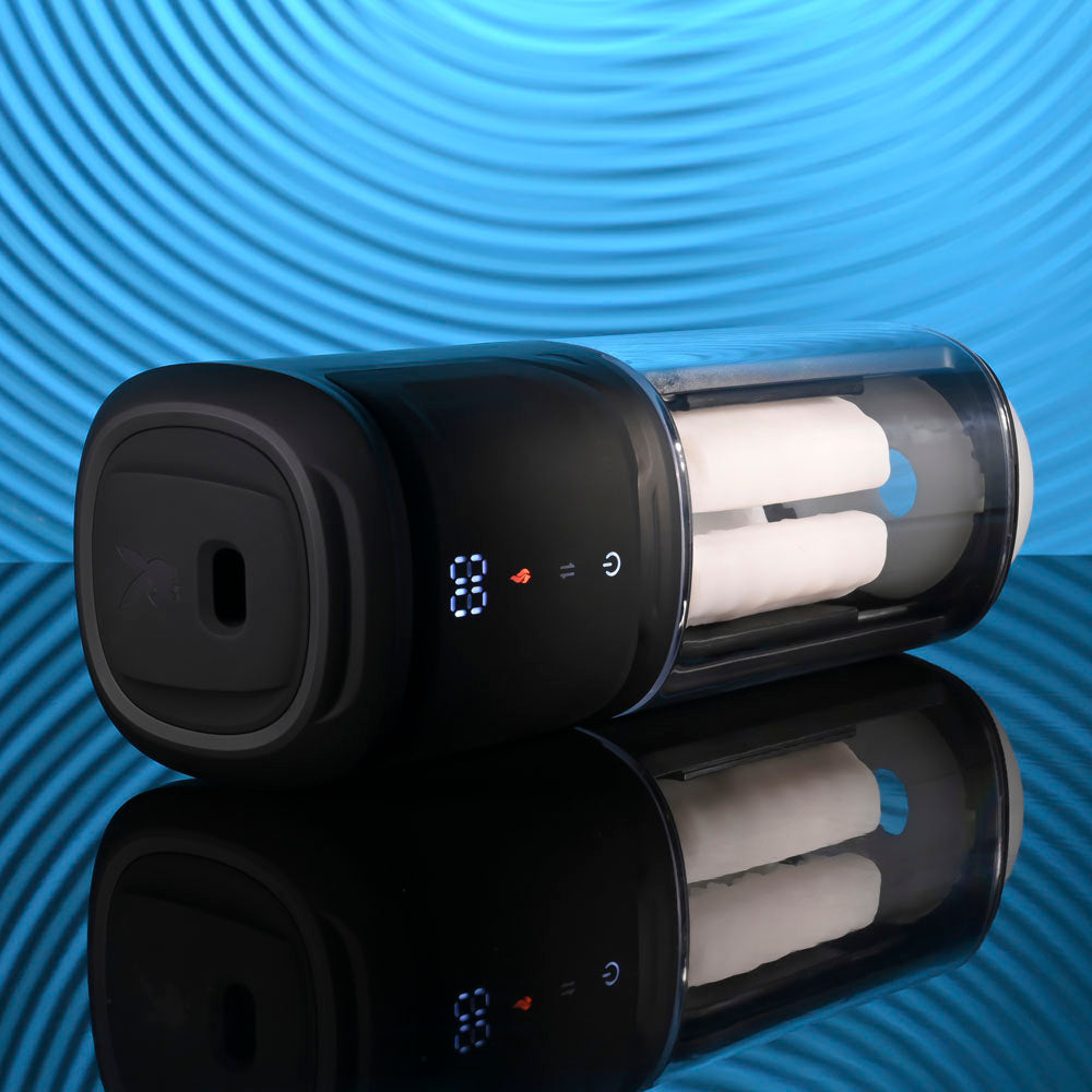 Playboy Pleasure SIDE PIECE - USB Rechargeable Warming Auto Stroker design with a sleek black exterior and visible stroker pads.