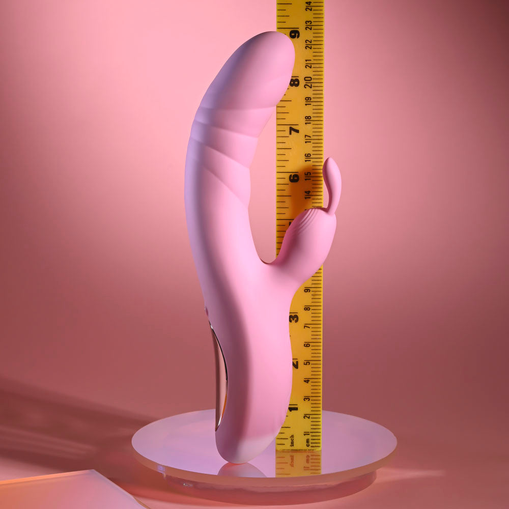 Playboy Pleasure RUB ME RIGHT - 23.2 cm USB Rechargeable Thrusting Rabbit Vibrator next to a ruler for size comparison.