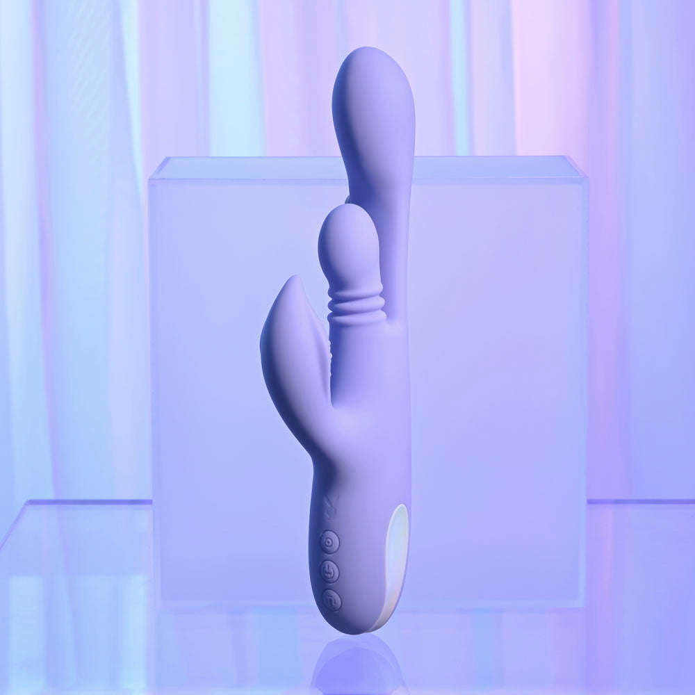 Playboy Pleasure NUBBIN RUBBIN - 24.1 cm USB Rechargeable Thrusting Rabbit Vibrator on display with soft lighting.