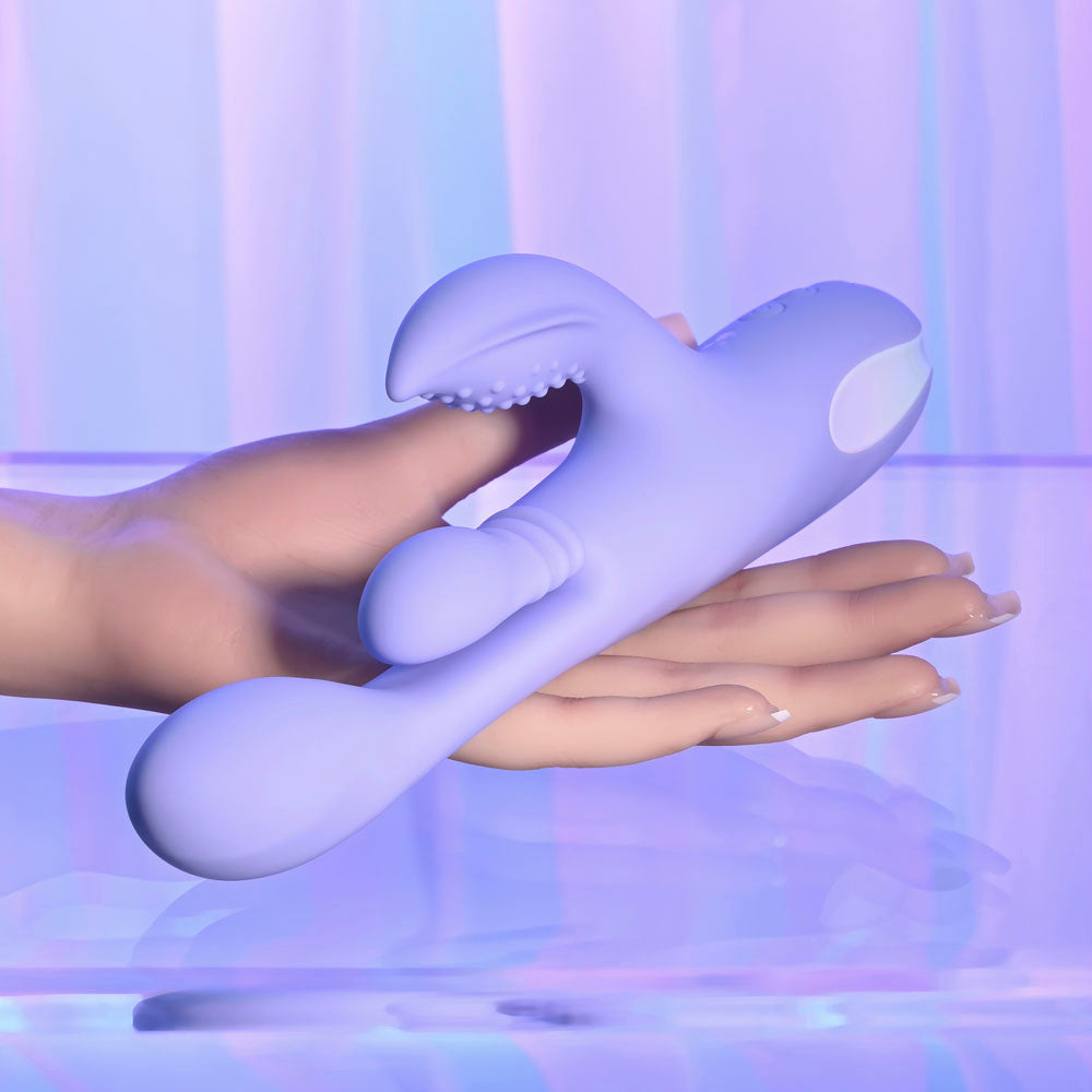 Playboy Pleasure NUBBIN RUBBIN - 24.1 cm USB Rechargeable Thrusting Rabbit Vibrator in hand, showcasing its sleek design.