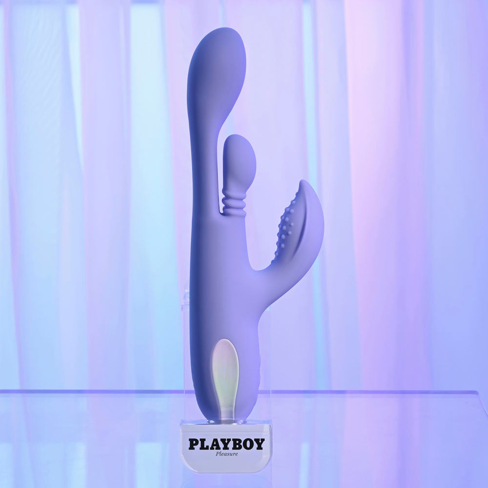 Playboy Pleasure NUBBIN RUBBIN - 24.1 cm USB Rechargeable Thrusting Rabbit Vibrator displayed on a stand.