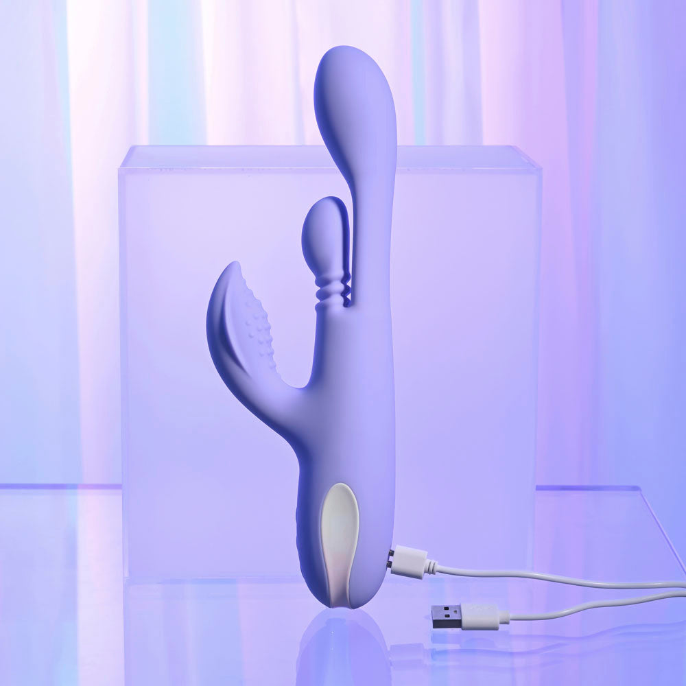 Playboy Pleasure NUBBIN RUBBIN - 24.1 cm USB Rechargeable Thrusting Rabbit Vibrator on a soft background.