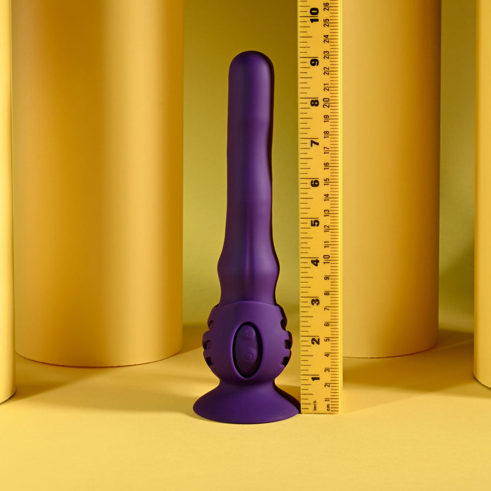 Playboy Pleasure WIGGLE IT - 23.9 cm USB Rechargeable Wiggling Vibrator with a ruler for size comparison on a yellow background.