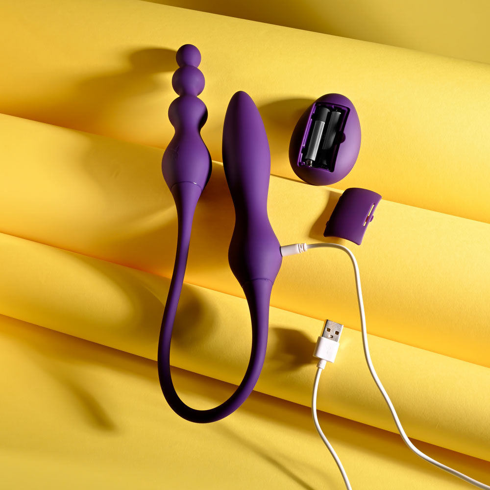 Playboy Pleasure THIS & THAT - 60 cm USB Rechargeable Flexible Dual Ended Vibrator on yellow background.