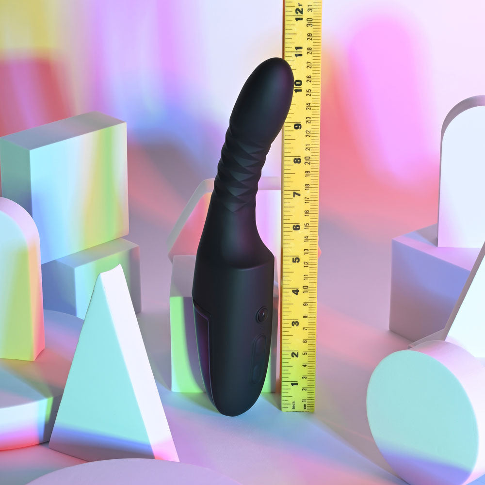 Playboy Pleasure OVERDRIVE -  28.2 cm USB Rechargeable Thrusting Vibrator next to a ruler on a colorful background.