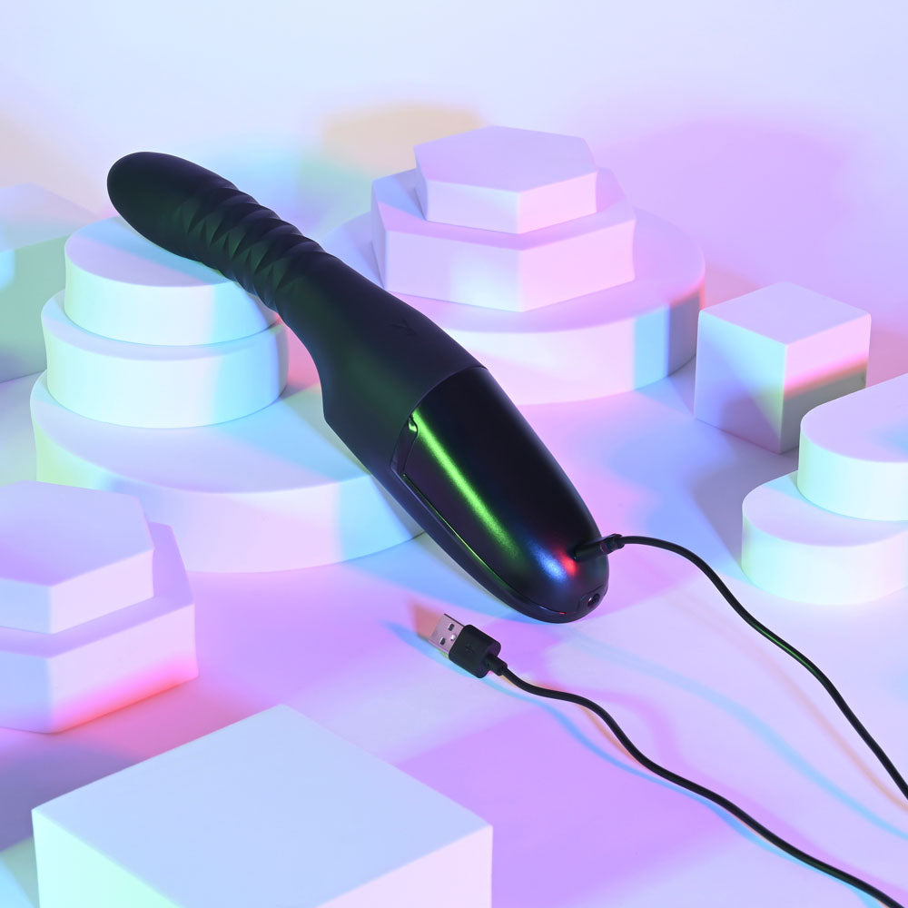 Playboy Pleasure OVERDRIVE - 28.2 cm USB Rechargeable Thrusting Vibrator on a colorful backdrop with a USB charging cable.