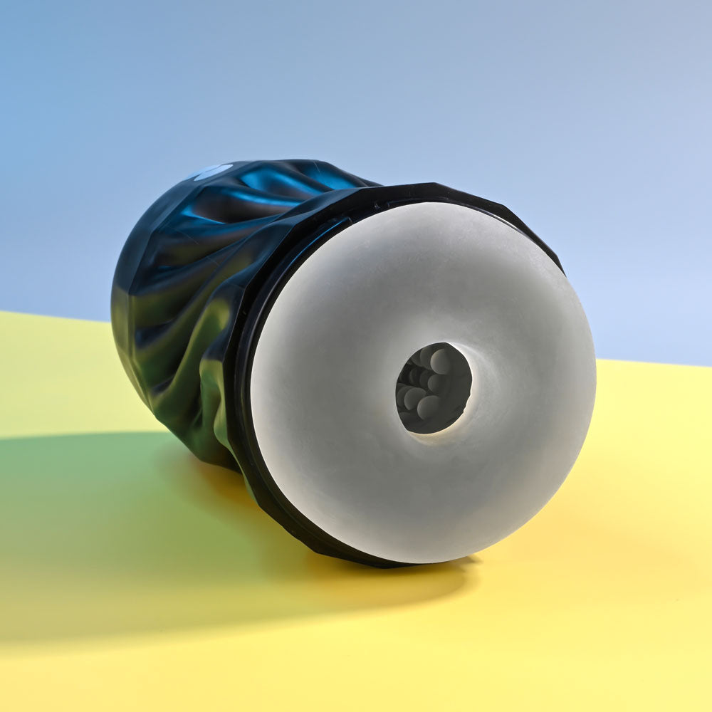 Playboy Pleasure SOLO - USB Rechargeable Vibrating and Sucking Stroker on a colorful background