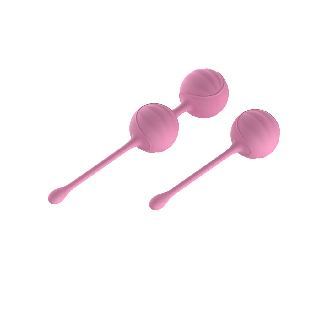 Passion Play silicone kegel ball set in soft pink for pelvic floor training and body awareness.