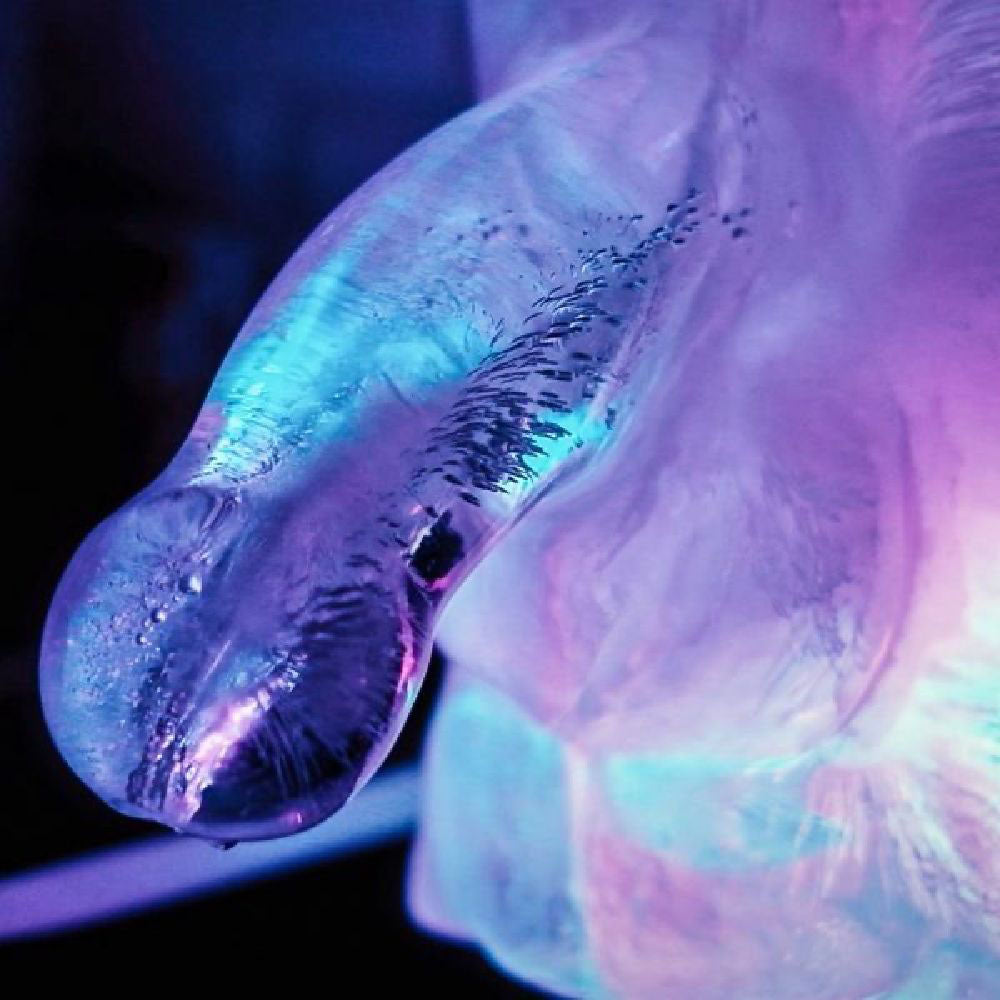 Huge Penis Ice Luge - Party Novelty featuring intricate frozen details and vibrant lighting.